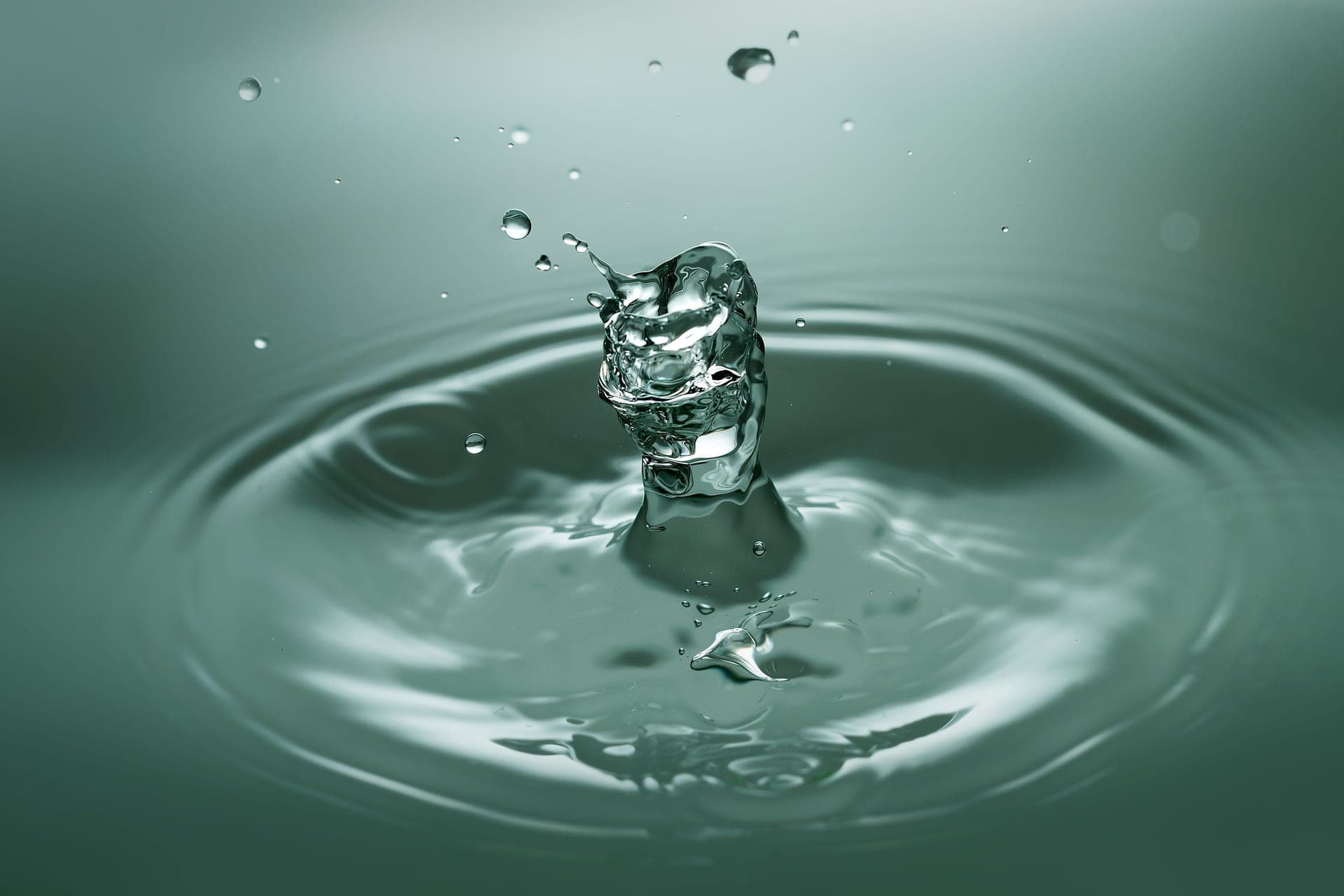 Water and light foam against a calm porcelain-toned background